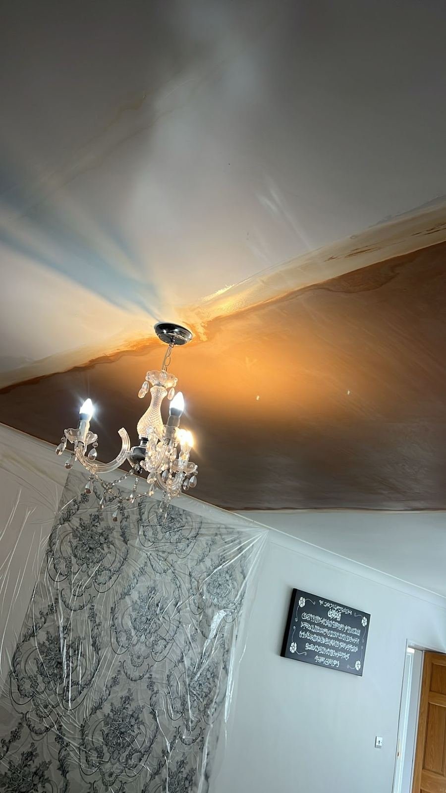 New plastered ceiling above a chandelier