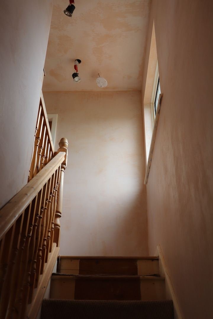 Stairwell plastered top to bottom